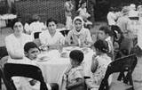 Attending this garden party are (from left to right) my mother Girgee, her sister Flora, my grandmother Aziza with myself (Daniel) on the right. My sister Louise has her back to the camera and my brother Joe is turning to face the camera. (1936)